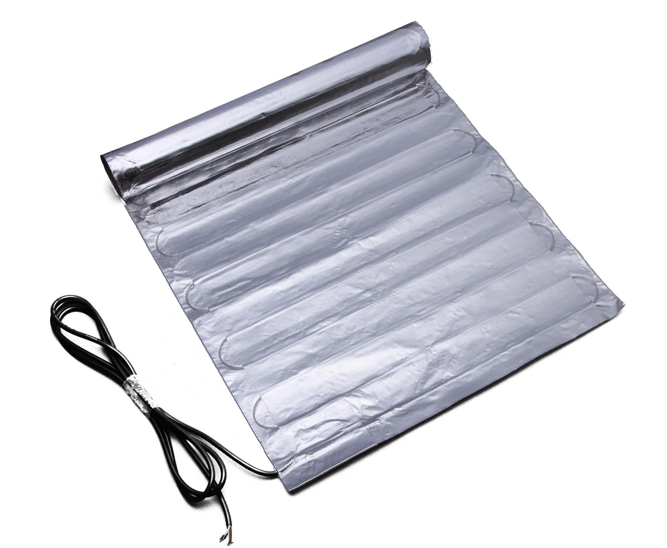 Partially rolled foil heating mat with serpentine cable runs and a power lead.