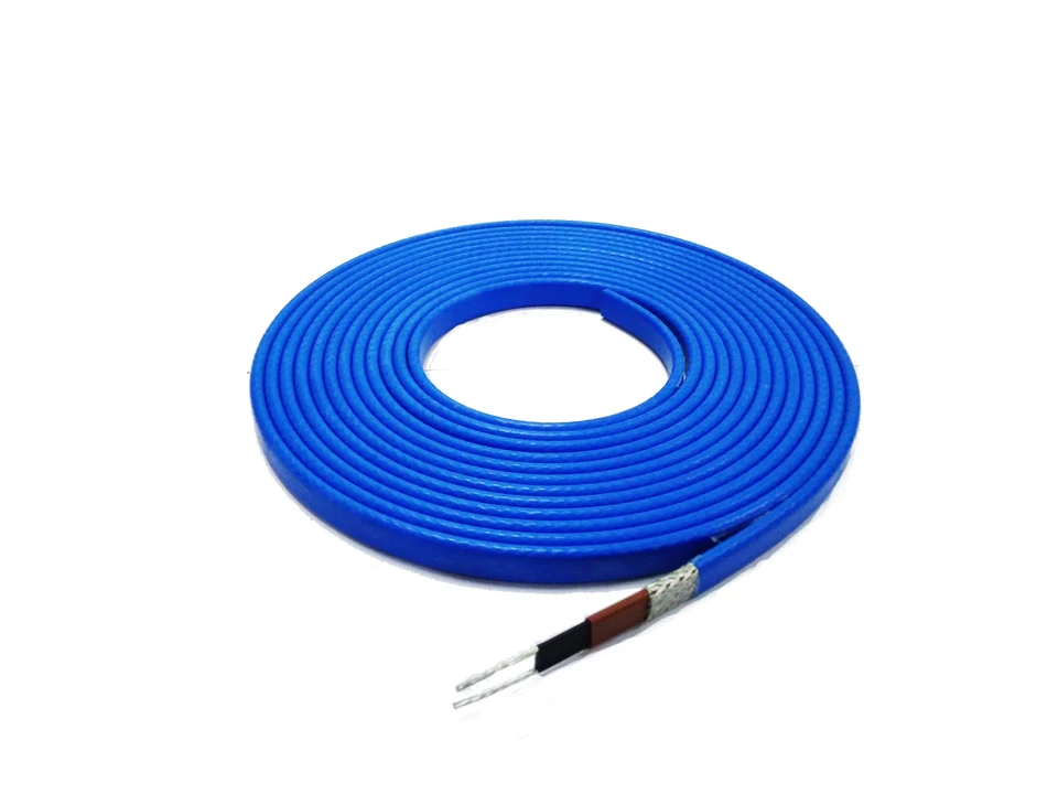 Coiled blue self-regulating heating cable with exposed layers at one end.