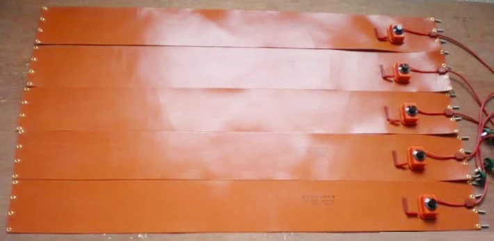 Five orange silicone heating strips with wired temperature controls.